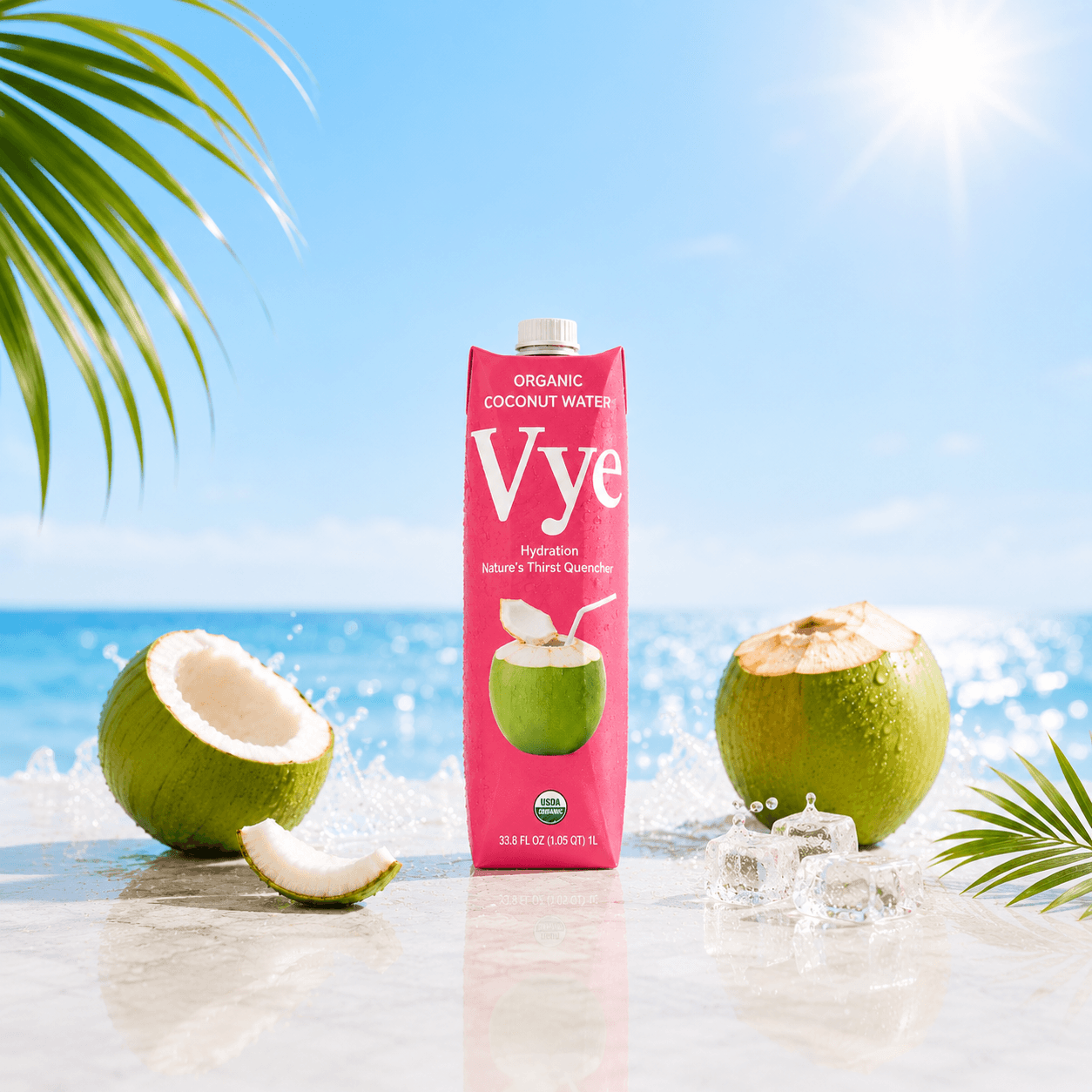 Vye coconut water carton with fresh coconuts by the ocean